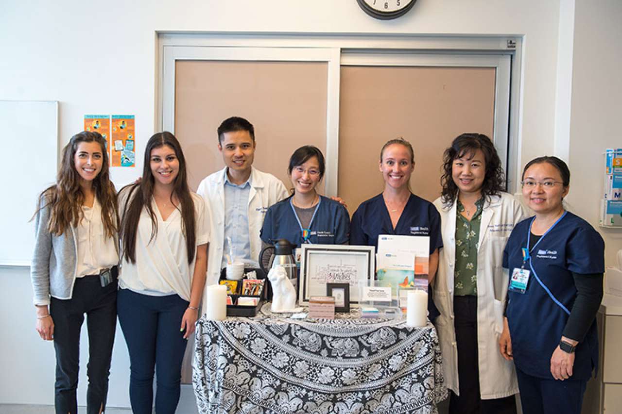 Seven members of the 3 Wishes Program team promoting the program inside a hospital.