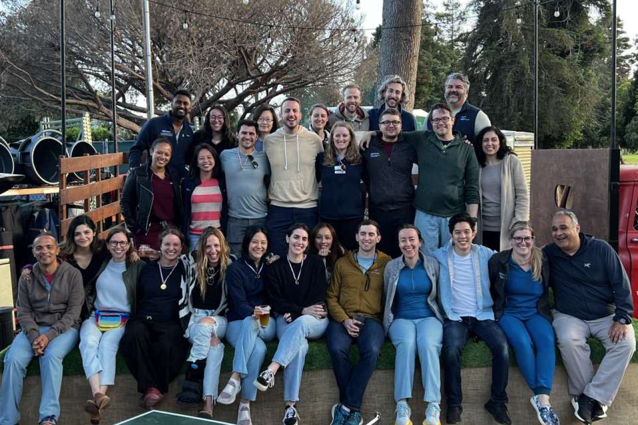 A big group of fellows and doctors together on retreat. 