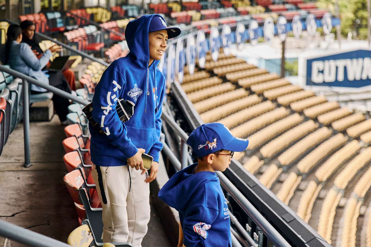 A teen oncology patient and his cousin look out at the field inside Dodger Stadium.