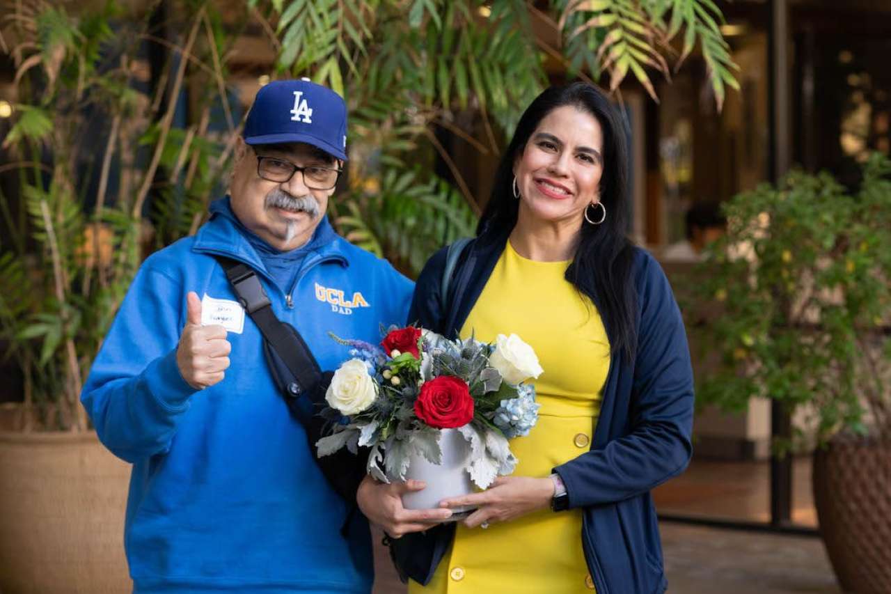 A UCLA alumna poses with her veteran father for the Nov. 9, 2023, luncheon celebration.