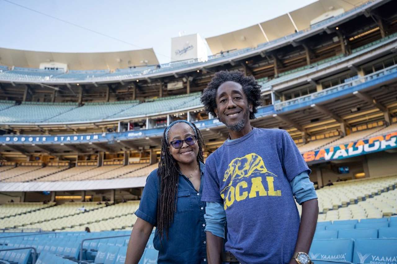 Reed siblings pose at Dodger Stadium with empty seats in the background
