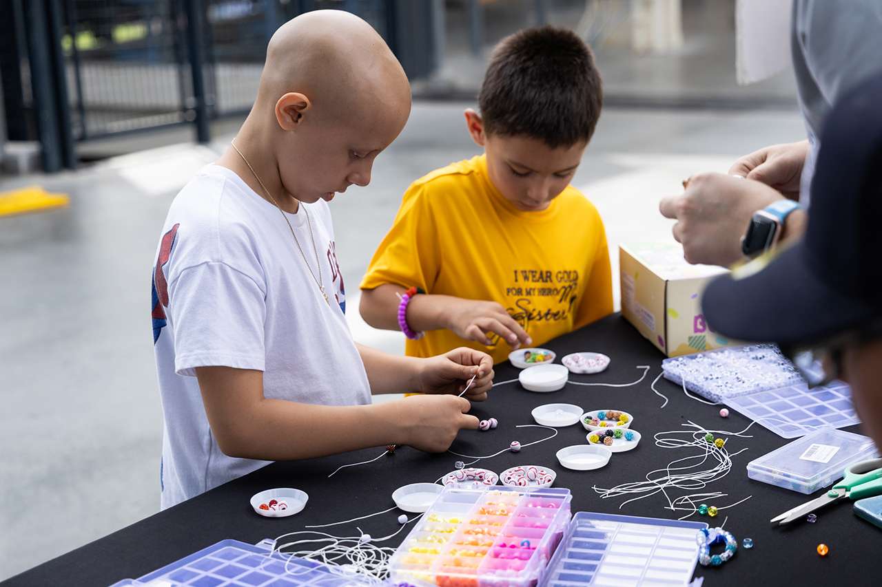 Young patient with cancer has fun with crafts at Dodger Stadium