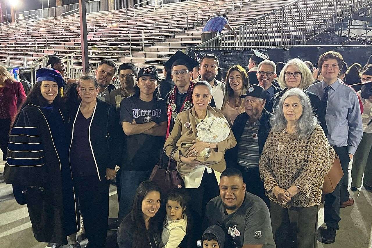 ucla bridges trainee cristian rodriguez at graduation surrounded by his family and mentors