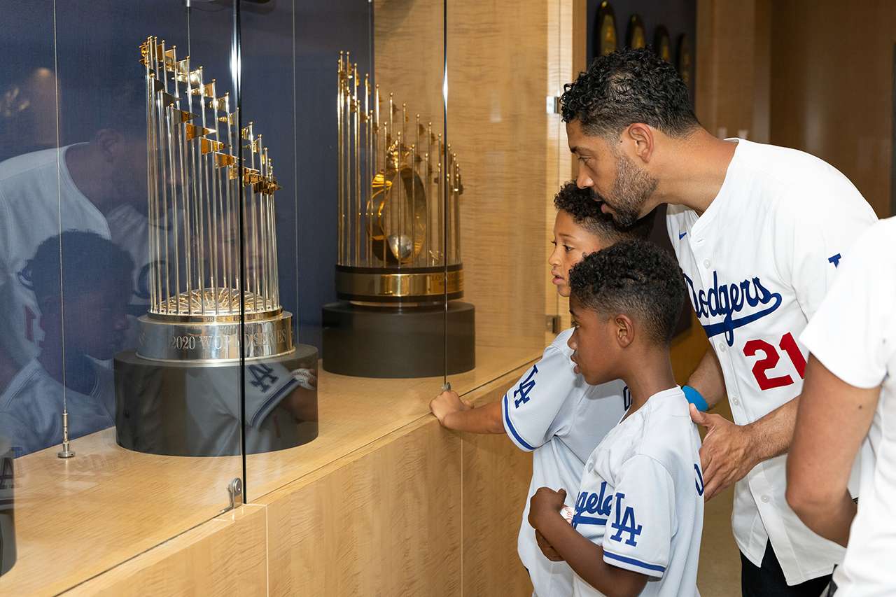 Kristofer Jones and two sons tour the trophy room at Dodger Stadium