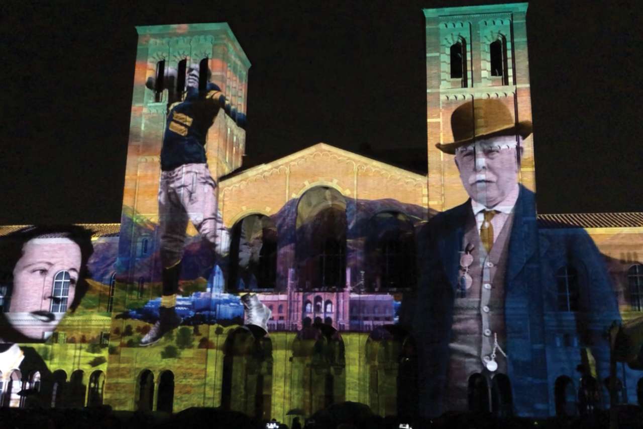 Campus building with light show projected onto it