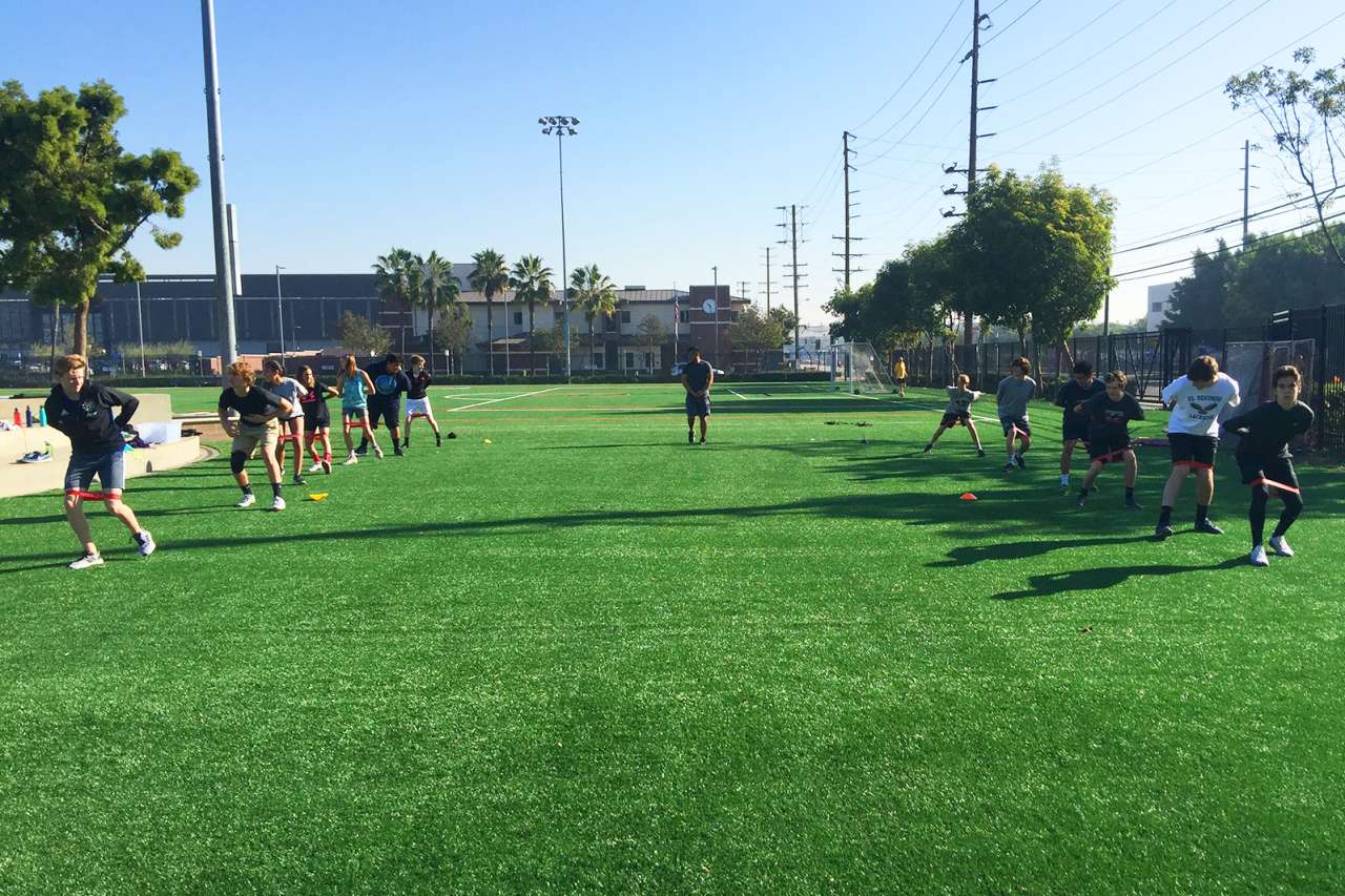 Sports Performance Center training outdoors on grass