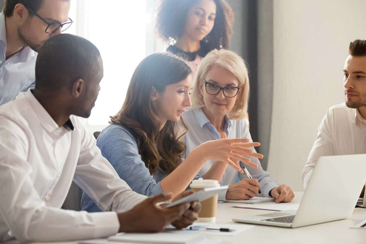 Group working around laptop