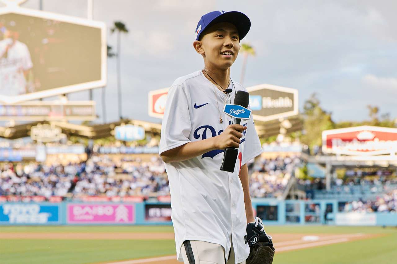 A teen oncology patient is honored on the field at Dodger Stadium.