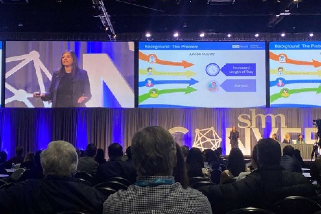 Dr. Ruchi Jain presenting on the main stage of a conference