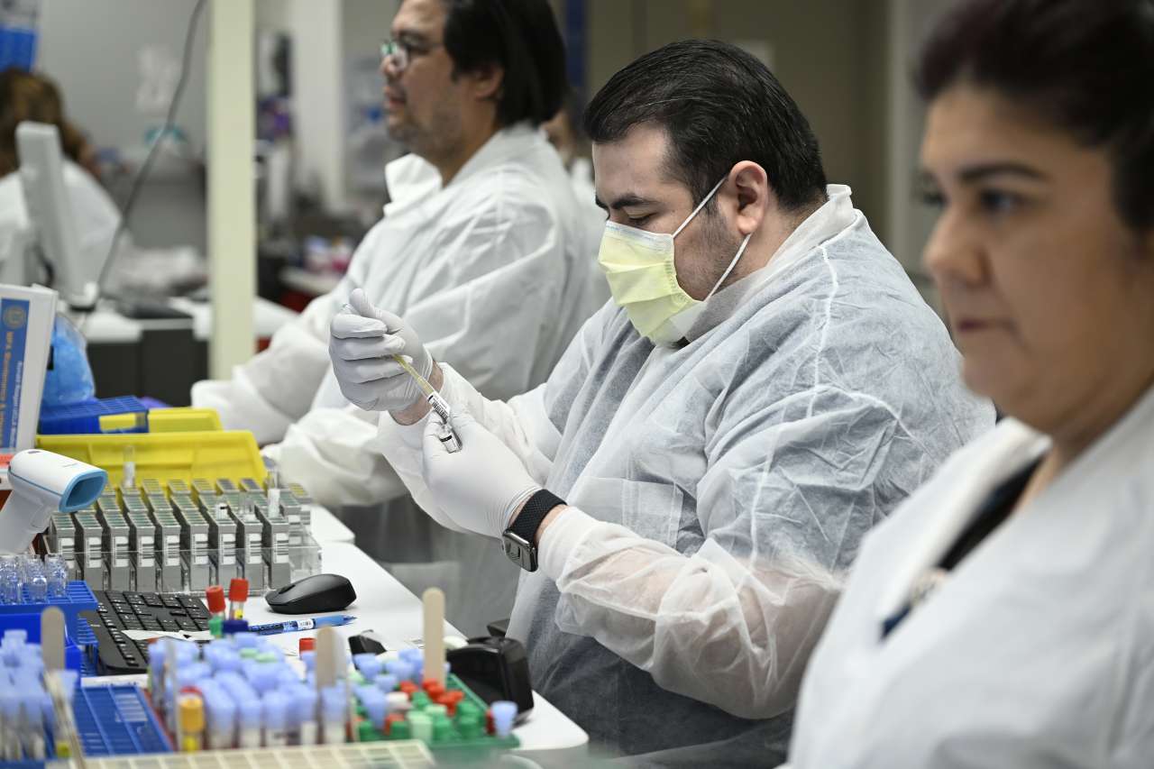 Lab scientists performing tests