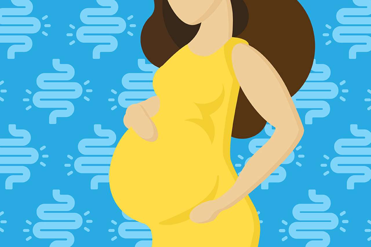 Illustration of the silhouette of a pregnant woman with IBD
