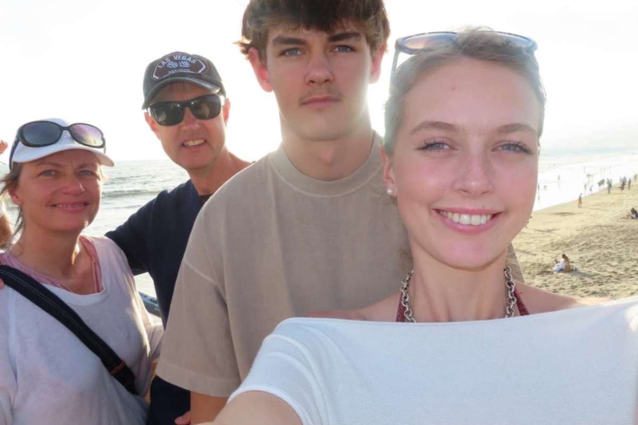 Sophie with her family at the beach