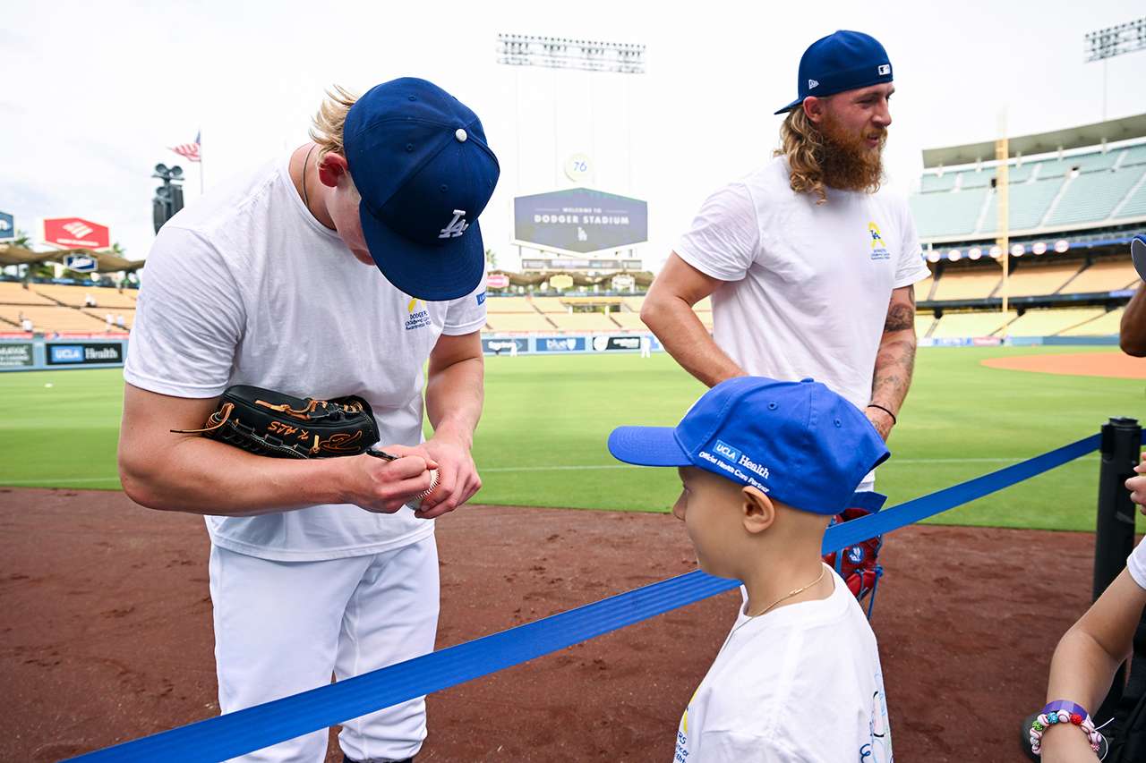 Emmet Sheehan signs an autograph for a young guest.