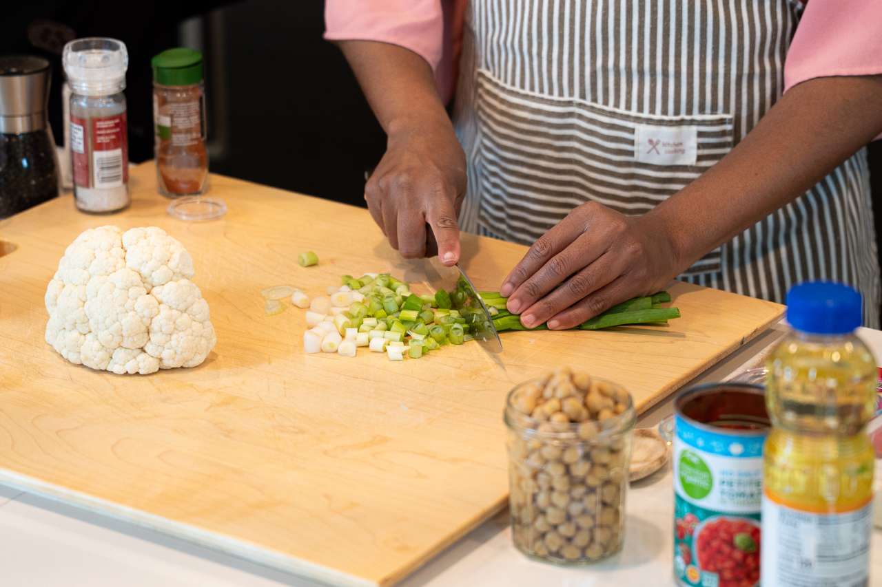 Dr. Kymora Scotland chops up ingredients