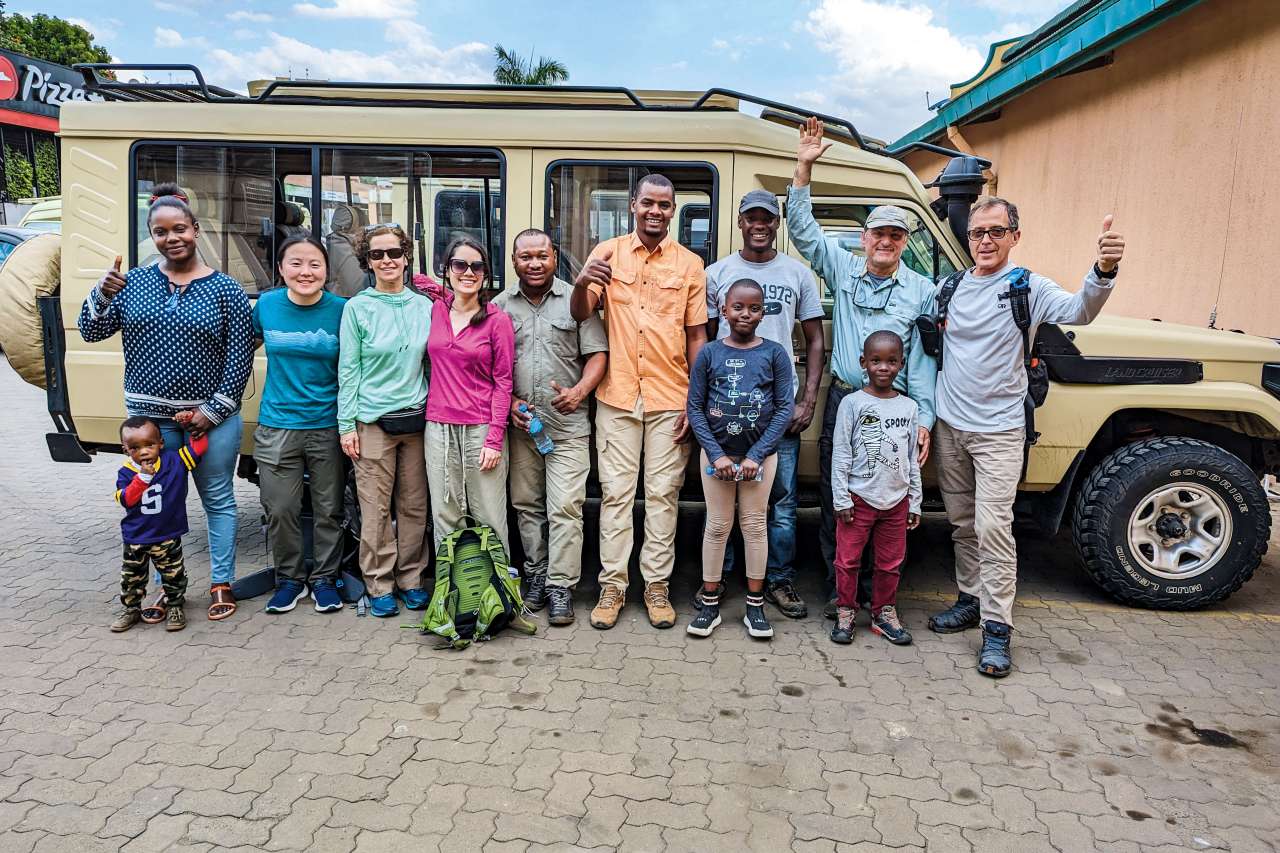 Dr. H. Albin Gritsch (second from right) with members of his safari group after the climb on Mt. Kilimanjaro, including guide Stanley Mariki (third from right) and his children and wife, Einoth (left)