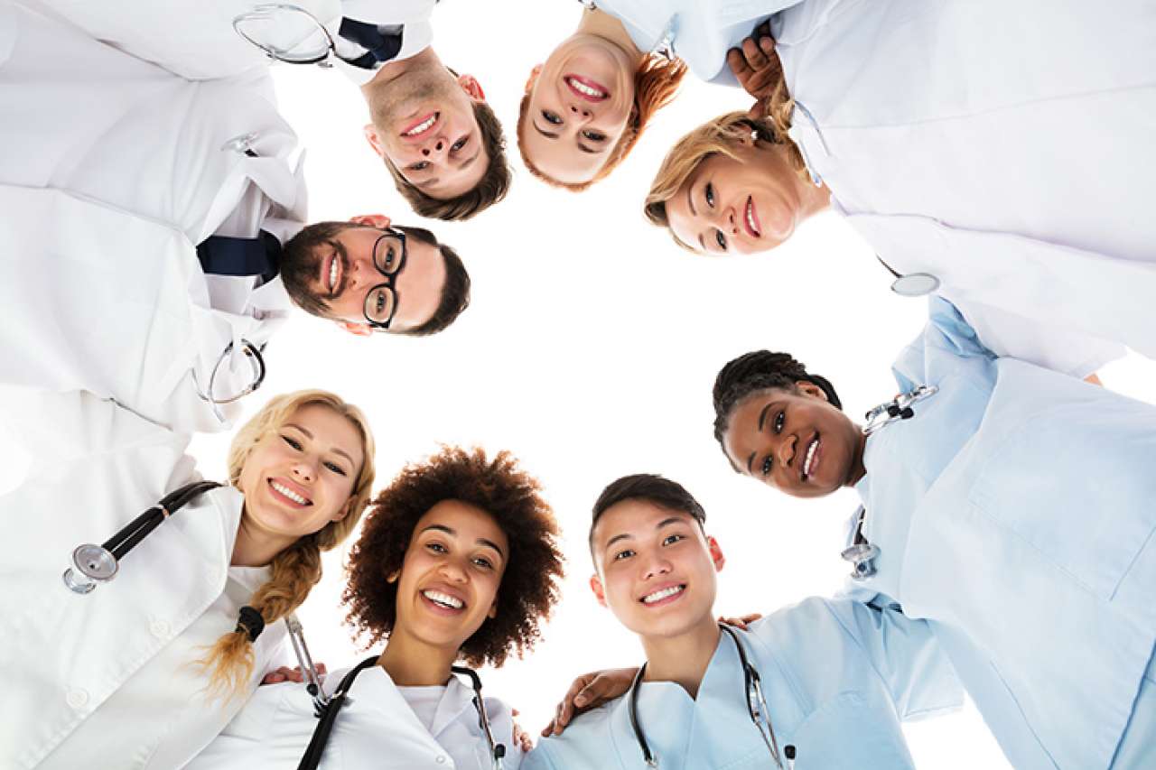 Doctors standing together in a circle