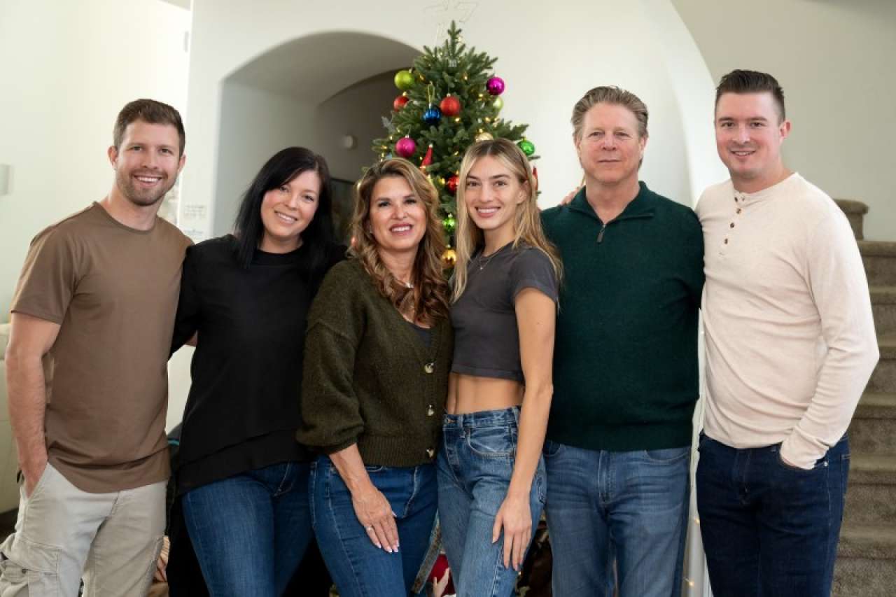 Nanette home with family