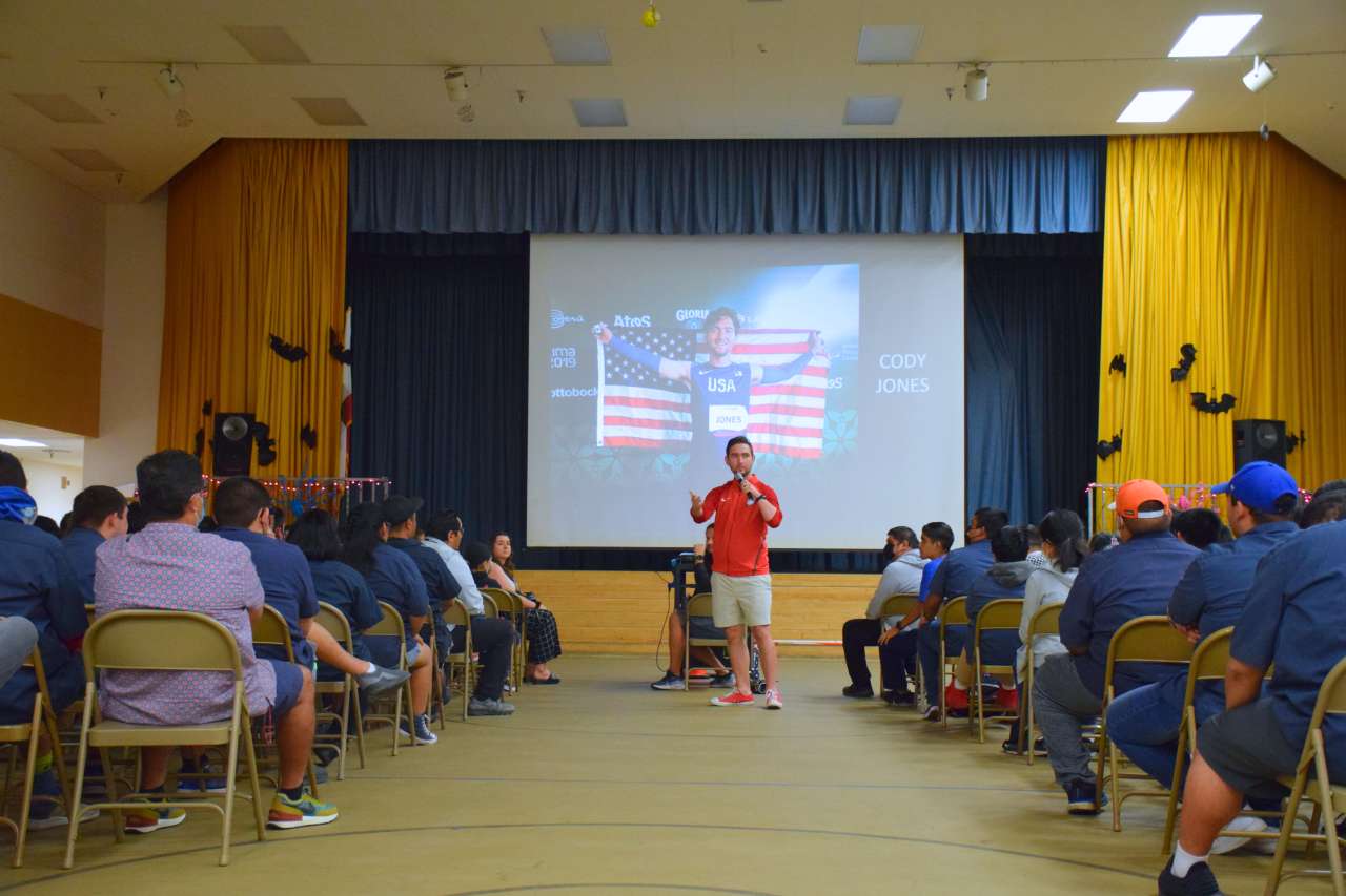 Cody Jones presenting to a group of students