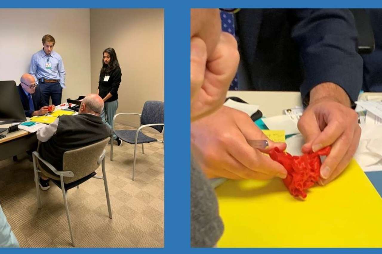 doctors reviewing heart model