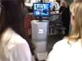 Doctors looking at robot