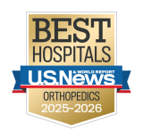 Gold badge with "Best Hospitals" at the top, a blue ribbon with "U.S. News & World Report," and "Orthopedics 2025-2026" below.