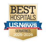 Gold badge with "Best Hospitals" at the top, a blue ribbon with "U.S. News & World Report," and "Geriatrics 2025-2026" below.
