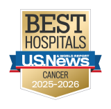 Gold badge with "Best Hospitals" at the top, a blue ribbon with "U.S. News & World Report," and "Cancer 2025-2026" below.