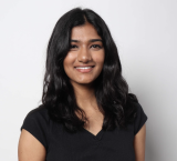 Headshot of Jagruti Kolla, who has dark hair and is wearing a black shirt.