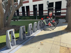 Docking station for Metro Bike Share with several empty docks and a few docked bikes on the right.