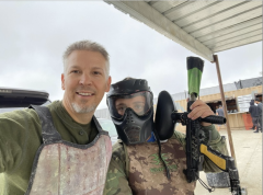 Robert Briel, MSN, CRNA, and son playing paintball 
