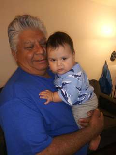 Jose Zubia holds his grandson Jaden.