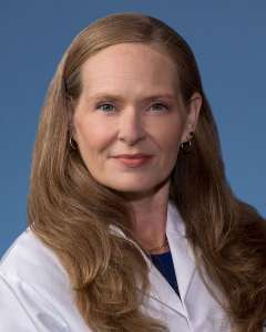 Rebecca Sosa, PhD in a white lab coat