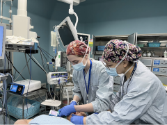 Dr. Allison Woods intubating with attending mentor, Dr. Zuo