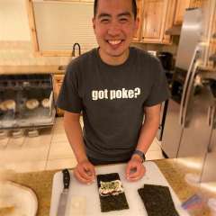 Dr. Tan making spam musubi with a smile