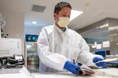 A clinical laboratory scientist at the blood bank’s “issue bench” conducts further reviews before Leanna receives her transfusion