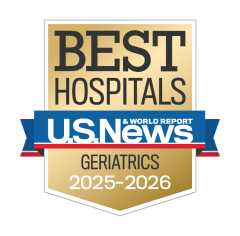 Gold badge with "Best Hospitals" at the top, a blue ribbon with "U.S. News & World Report," and "Geriatrics 2025-2026" below.