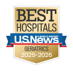 Gold badge with "Best Hospitals" at the top, a blue ribbon with "U.S. News & World Report," and "Geriatrics 2025-2026" below.