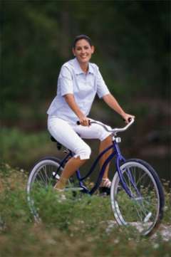 woman riding bicycle in nature