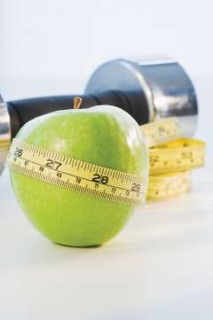 Apple with measuring tape around it
