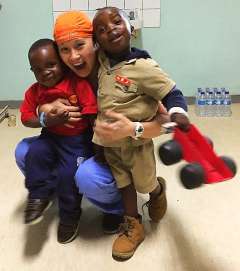DR CHRISTINE TRIEU WITH TWO PATIENTS IN ZIMBABWE