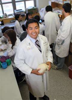 Dr. Yang holding a skull