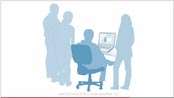 Image of blue silhoutte figures standing around a desk