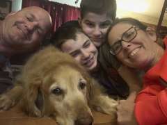 Brock Graham with his family and the family dog Starsky