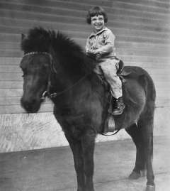 Professor Joseph K. Perloff at four years old sitting on a horse