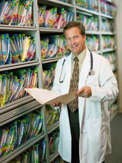 Doctor reading file
