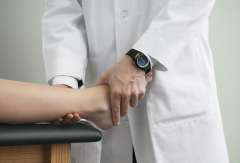 Doctor examining patients ankle