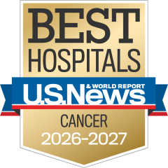 Gold badge with "Best Hospitals" at the top, a blue ribbon with "U.S. News & World Report," and "Cancer 2026-2027" below.