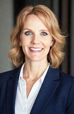 Donna Wellbaum wearing a blazer and white shirt.