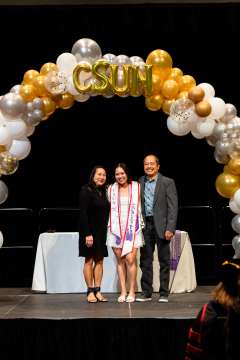 DAPM staff Darnell Bagsik with her parents at pinning ceremony