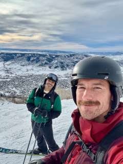 Dr. Dane Saksa and husband, Ryan, skiing on vacation